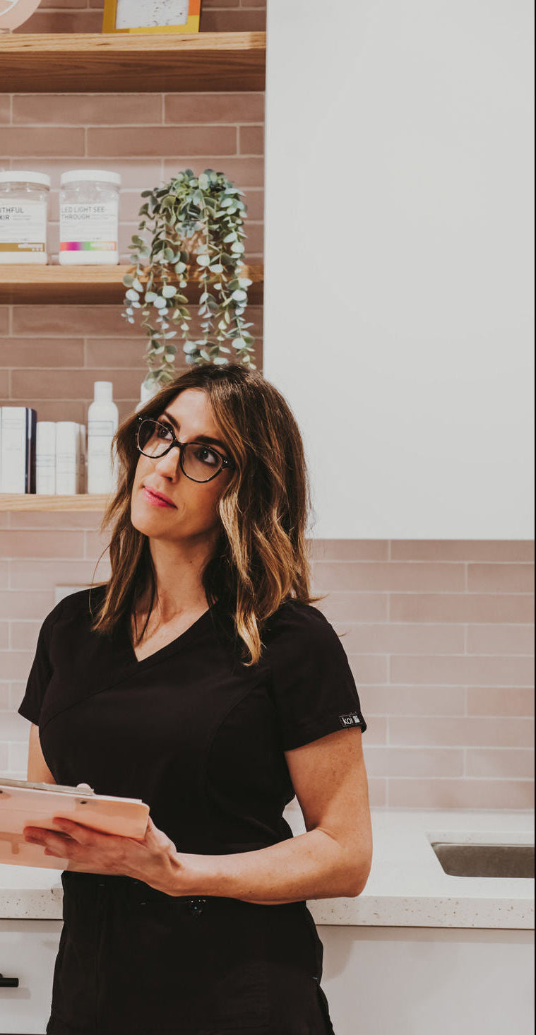 licensed esthetician having a consultation in a skincare setting